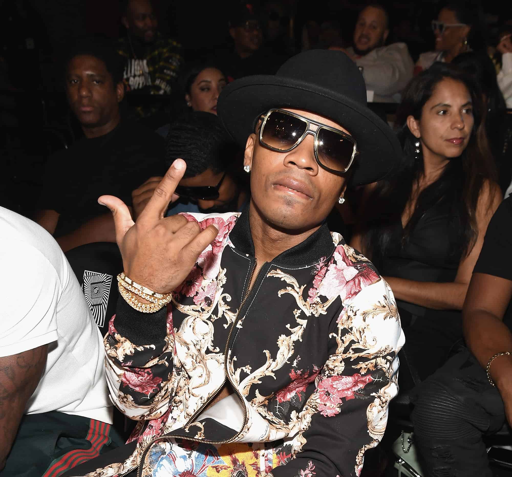 Lagen reveal his new smile after burying his infamous gold teeth