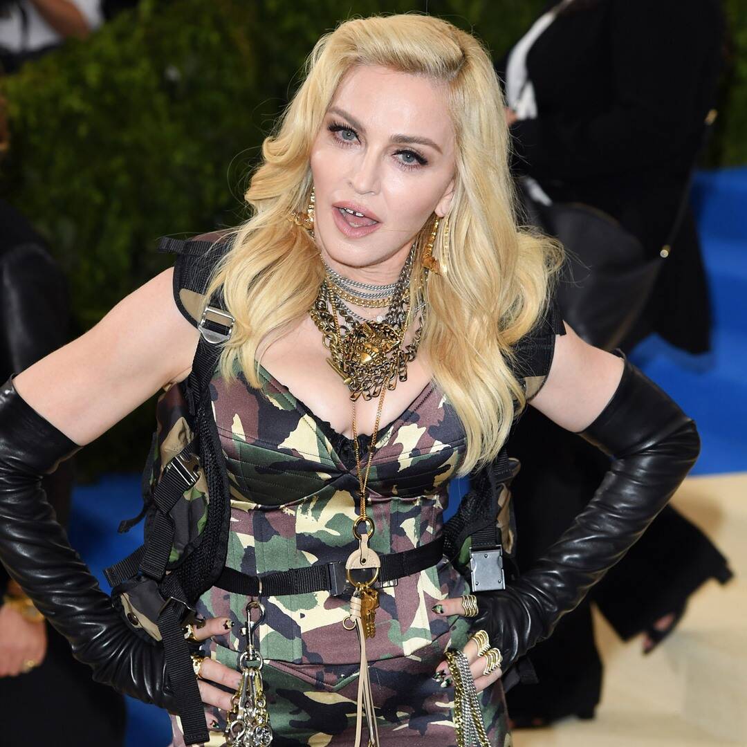 Madonna accused of laying her face on the fan's body: see picture