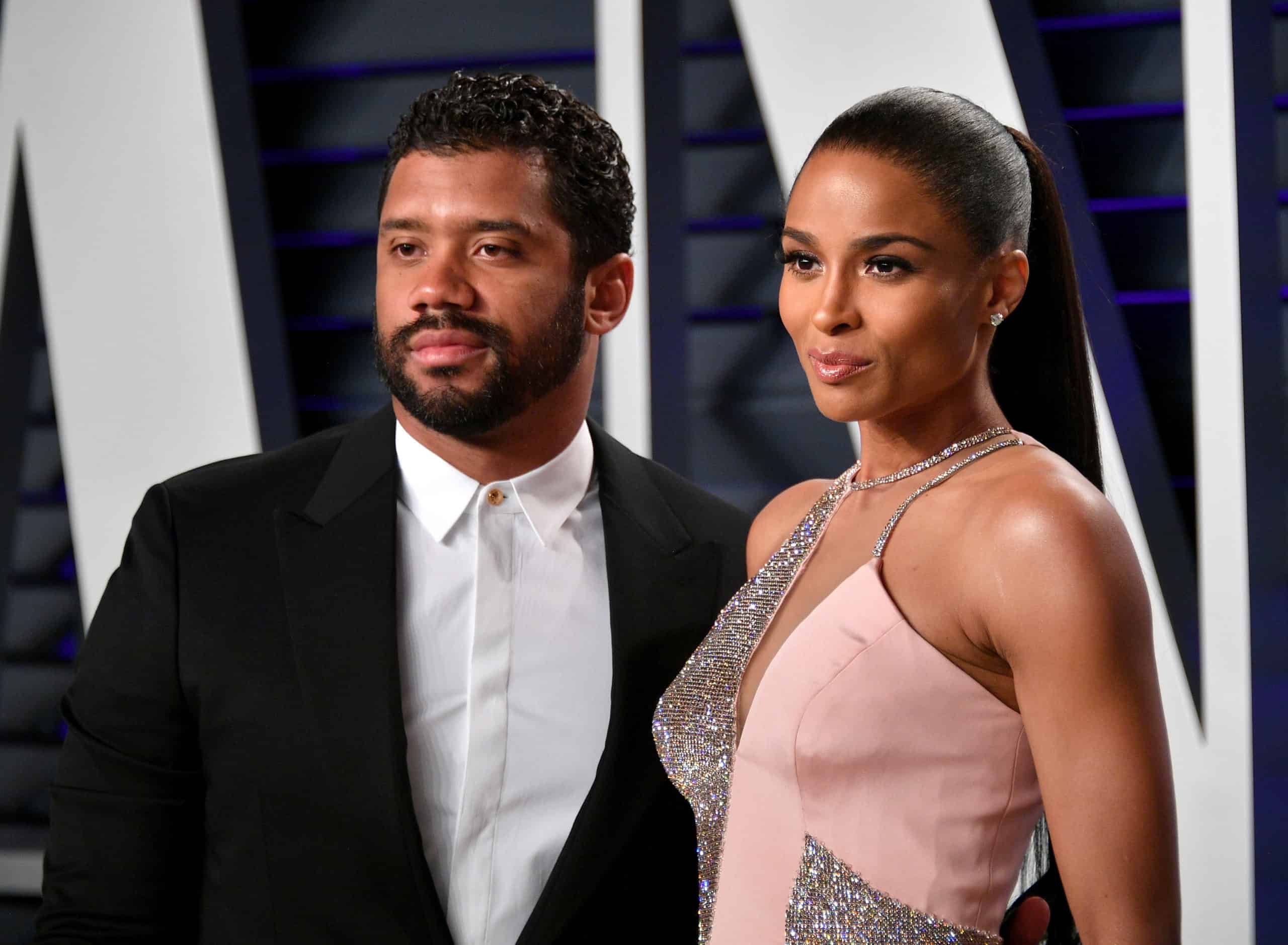 Russell Wilson & Ciara surprise middle school students with starting their own savings accounts