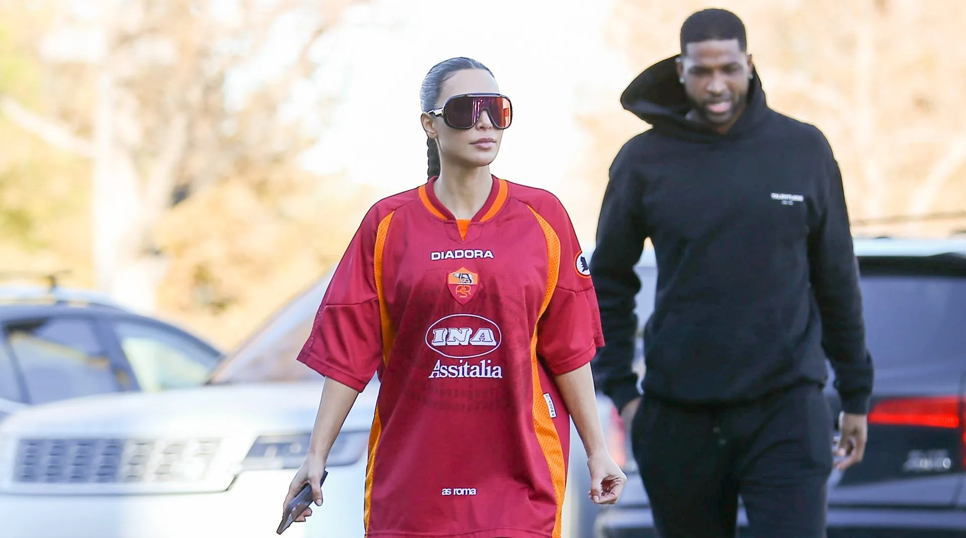 Kim K slams paparazzi asking if Kanye West threw a phone