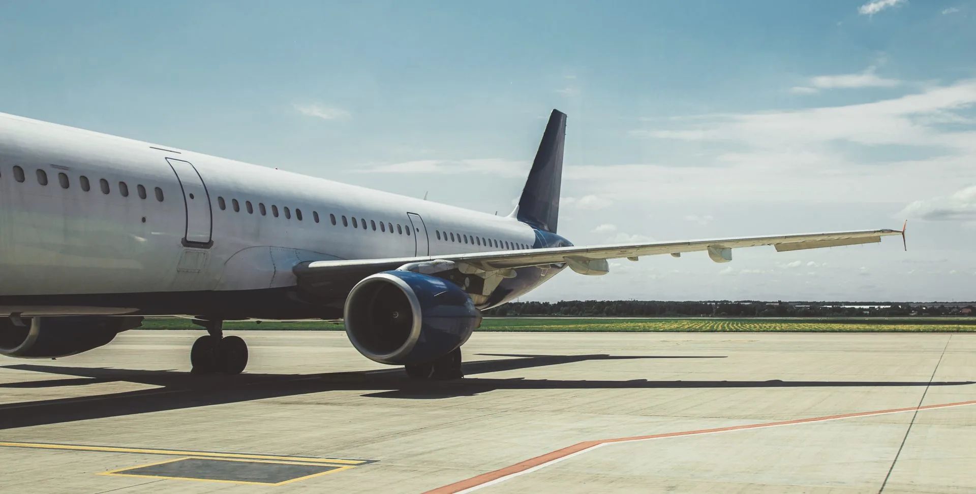 Bye honey!  Couple dropping toddler at airport check-in counter
